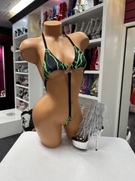 Neon green sling bodysuit with black base, strappy vertical design, and minimal thong coverage