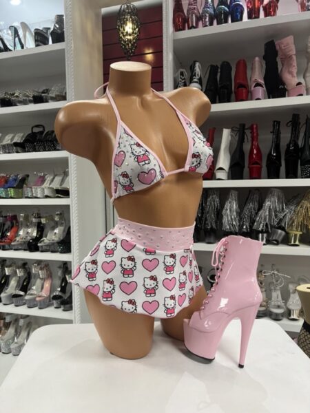Pink heart kitty print three piece skirt set with rhinestone waistband and triangle top displayed on mannequin
