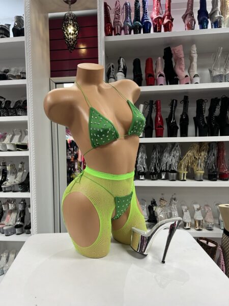 Green crystal garter set with triangle top, matching thong, neon fishnet garter-style shorts, side cutouts, and crystal accents.