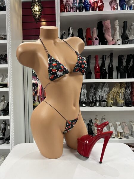 Cherry kawaii bikini set with triangle top, matching string thong, slim black ties, and playful cherry character print.