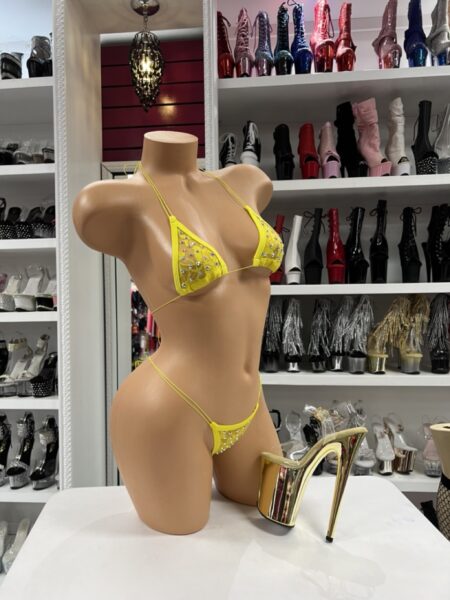 Yellow Crystal Micro Bikini with bright yellow triangle top, crystal accents, thin string straps, and minimal thong bottom on mannequin.