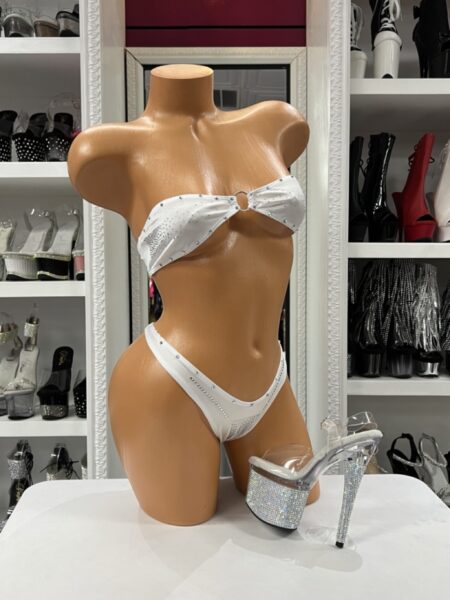 White Rhinestone Ring Bikini with white bandeau ring top, silver rhinestone accents, matching high-cut bottoms, and clear platform heel styling.