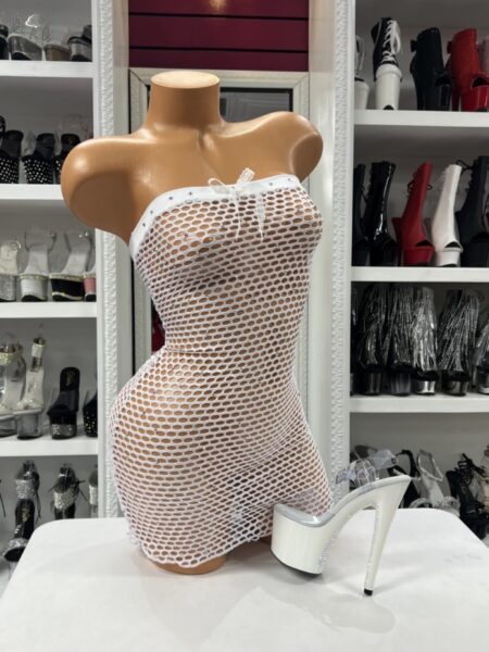White Fishnet Tube Dress with strapless tube neckline, open white net fabric, body-hugging mini length, and white platform heel styling.