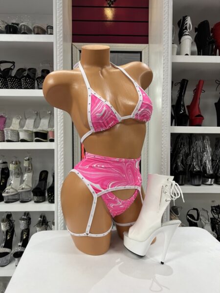 Pink Swirl Garter Set with pink and white swirl print, triangle top, high waist bottom, thong detail, rhinestone trim, and attached white garter straps