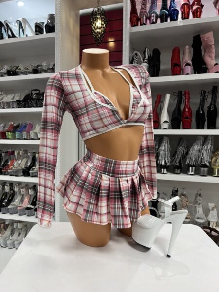 Model wearing pink plaid Blush Plaid Skirt Set with matching pleated skirt and bikini