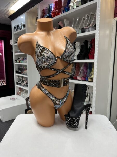 Model wearing leopard rhinestone wrap set with sparkling crystal details and crisscross waist straps