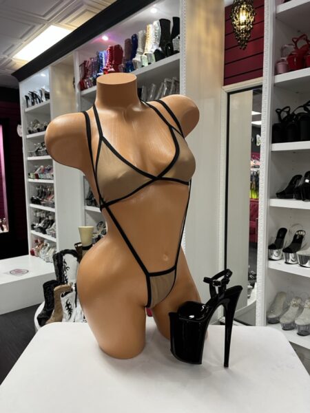 Nude mesh suspender bodysuit with sheer panels, black strappy trim, and open back thong styling