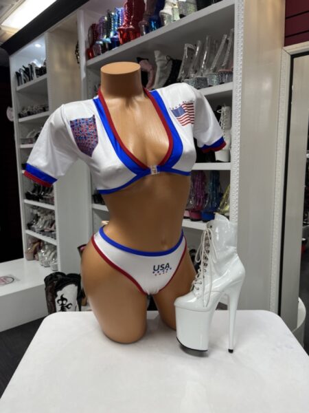 Patriotic USA bikini set featuring red white and blue colors, rhinestone accents, crop top, and matching bikini bottoms.