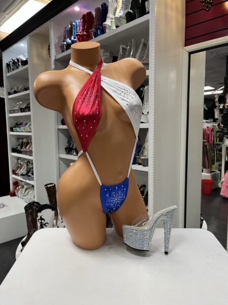 Patriotic Crystal Slingkini featuring red, white, and blue panels, crystal embellishments, an asymmetrical halter neckline, and an open-front design.
