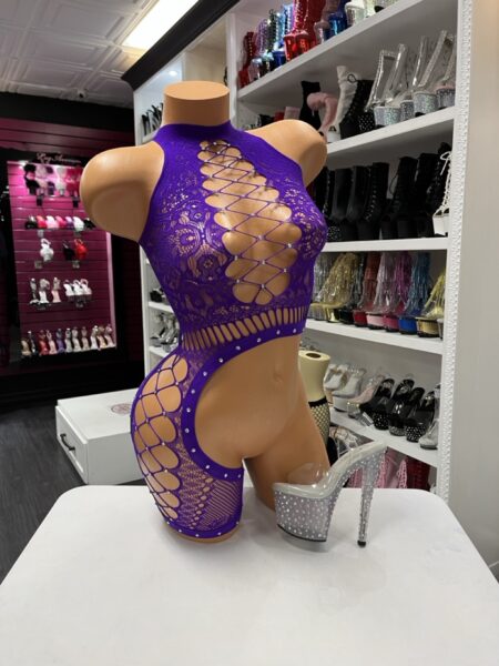 Plum One Leg Romper with floral lace, crystal embellishments, lace-up front, and attached asymmetrical fishnet leg detail.