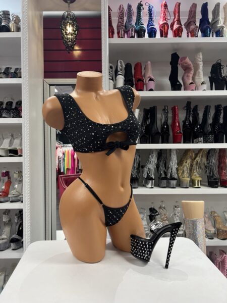 Black rhinestone cutout bikini set with sparkling embellishments and adjustable thong straps displayed on mannequin.