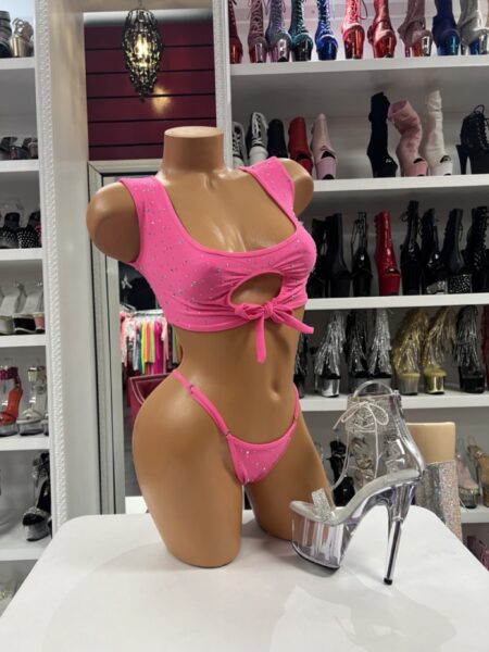 Pink Rhinestone Bikini Set featuring a ruched crop top with keyhole bow detail, crystal embellishments, and matching thong bottom displayed with clear platform heels.