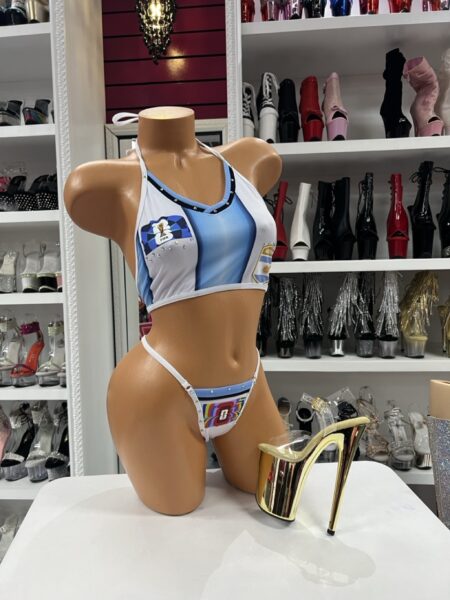 Celebrate soccer-inspired style with this sporty two-piece bikini featuring Argentina-themed graphics, crystal accents, and a flattering halter crop top. Perfect for game days, vacations, festivals, and themed events.
