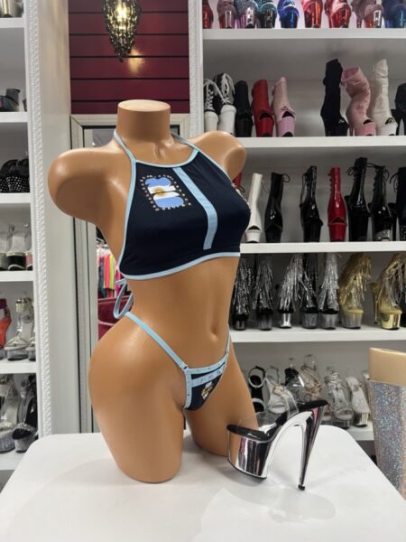 Argentine Spirit Bikini featuring navy fabric, sky blue trim, high-neck halter top, matching thong bottom, and Argentina-inspired graphics.