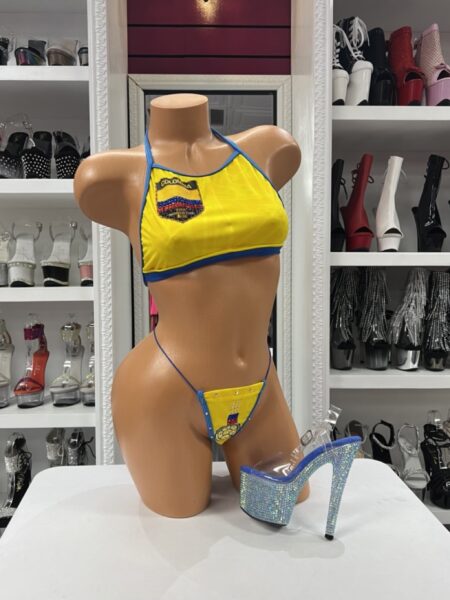 Colombian Soccer Bikini featuring yellow fabric, blue trim, halter-style top, matching thong bottom, and soccer-inspired embroidered details.