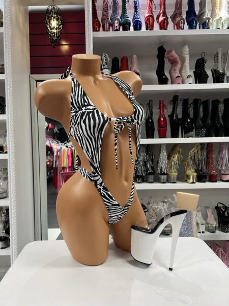 Zebra Tie Sling Monokini featuring a halter neckline, front tie accent, and dramatic open side silhouette.