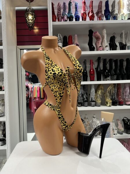 Golden Leopard Sling Monokini featuring a halter neckline, front tie detail, and dramatic open side silhouette.