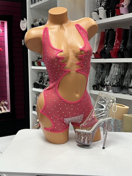 Pink Rhinestone Mesh Romper with sheer stretch mesh, lace-up front, sparkling rhinestones, and dramatic cutout details.