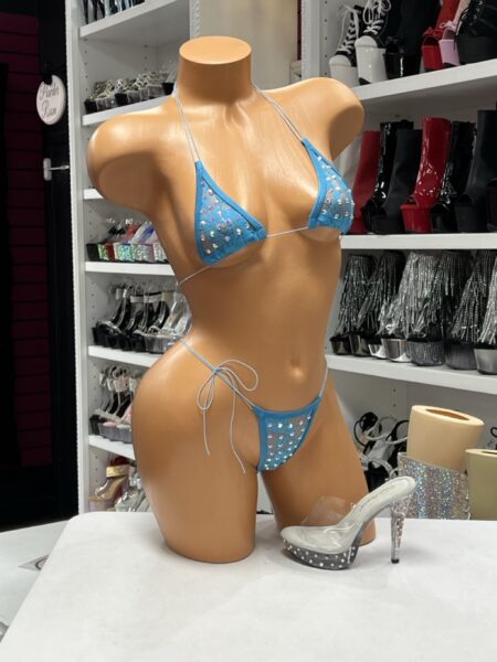 Sky Blue Lace Bikini with sheer lace panels, iridescent rhinestones, adjustable triangle top, and side-tie bikini bottoms.