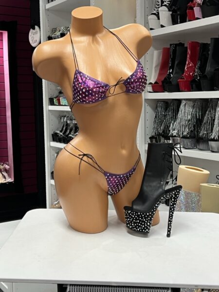 Purple Rhinestone Micro Bikini featuring sparkling rhinestones, shimmering purple fabric, adjustable triangle top, and side-tie micro bottoms.