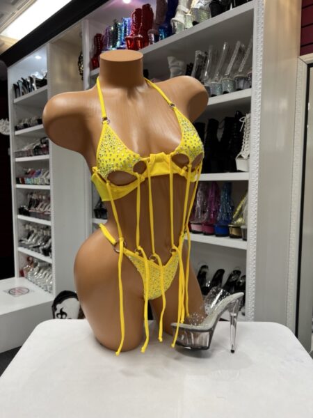 Yellow fringe two piece with rhinestone bikini top, matching bottoms, silver ring hardware, and dramatic hanging fringe.