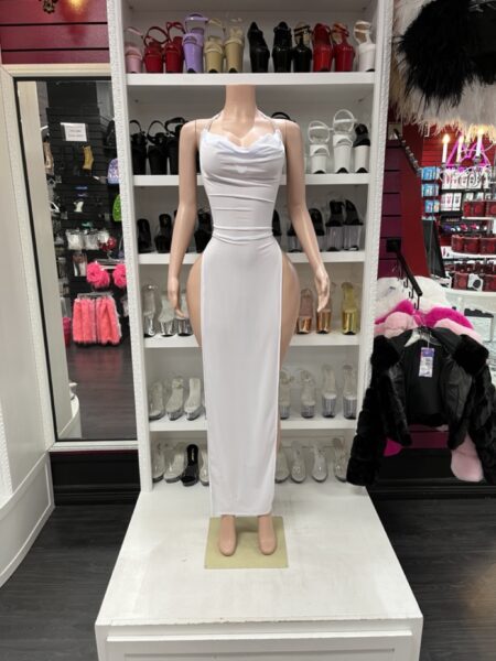 White side slit maxi dress with a draped cowl neckline, rhinestone shoulder straps, and dramatic high side slits.