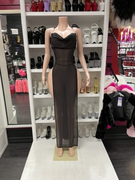 Black side slit maxi dress with sheer mesh fabric, adjustable straps, a draped neckline, and dramatic high side slits.