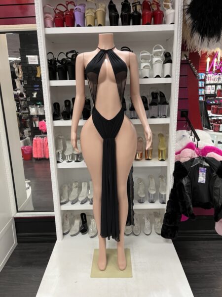 Black sheer halter dress with a plunging halter neckline, flowing front drape, sheer mesh side panels, and dramatic cutout styling.