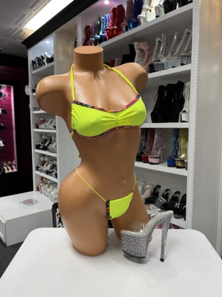 Neon yellow rhinestone bikini with colorful crystal trim, adjustable halter top, matching thong bottom, and vibrant festival-inspired design.