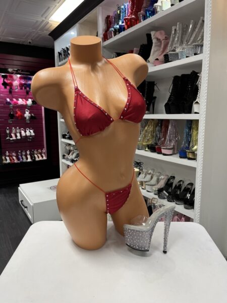 Red rhinestone bikini with adjustable triangle halter top, matching thong bottom, sparkling crystal trim, and a sleek minimalist design.