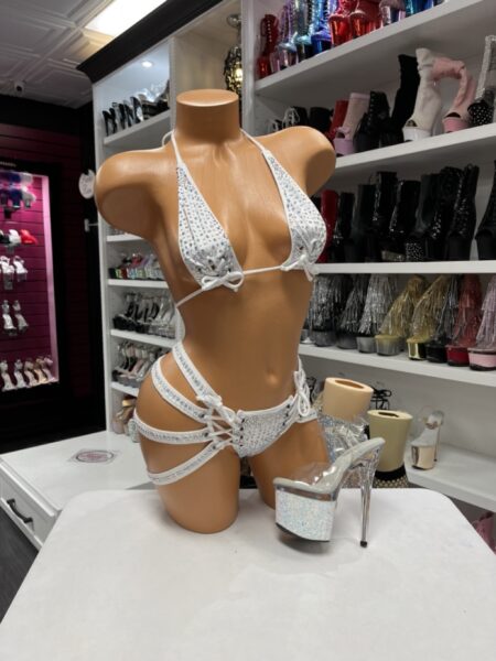 White Rhinestone Harness Bikini featuring sparkling rhinestones, adjustable triangle top with bow accents, multi-strap harness bikini bottom, soft stretch fabric, and elegant white finish.