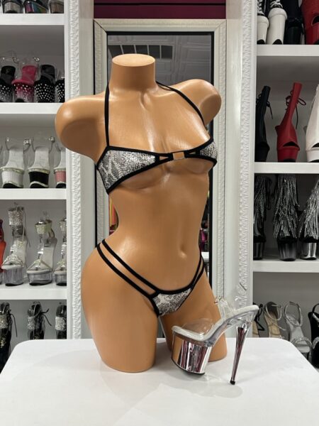 Silver Sequin Leopard Bikini featuring sparkling leopard sequin fabric, black trim, adjustable halter top, open center metal connector, and double side strap bikini bottoms.