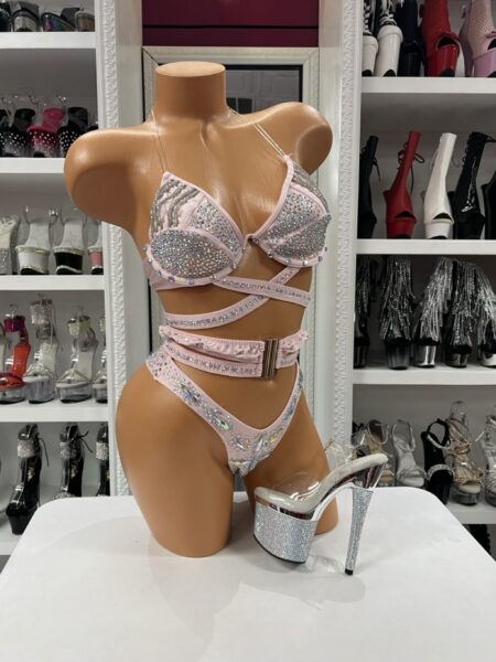 Blush Crystal Luxe Bikini featuring a blush pink crystal embellished two-piece set with wraparound straps, decorative buckle waistband, and iridescent crystal accents.
