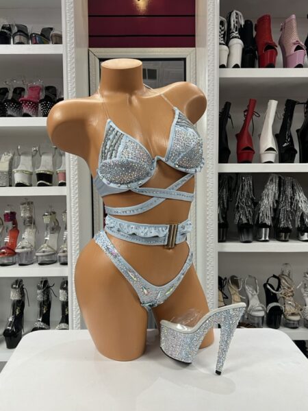Ice Crystal Luxe Bikini featuring a light blue crystal embellished two-piece set with wraparound straps, iridescent stones, and a decorative buckle waistband.