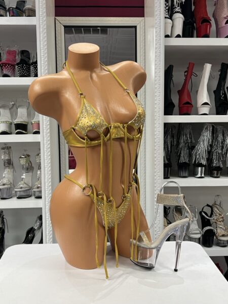 Turn every entrance into a statement with this dazzling two-piece bikini featuring sparkling crystal embellishments and dramatic hanging tassels. Adjustable ties and soft stretch fabric provide comfort while creating a flattering, eye-catching fit.