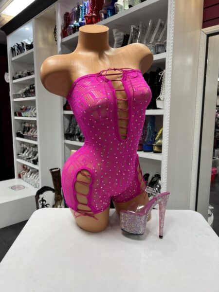 Pink Rhinestone Lace Romper with sparkling crystal embellishments, front lace-up detail, and side cutout design.