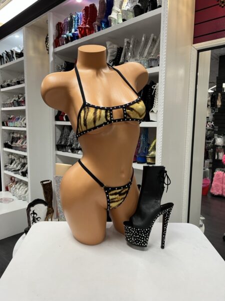 Tiger Crystal Bikini Set featuring a tiger print, crystal trim, adjustable halter top, and matching bikini bottoms.
