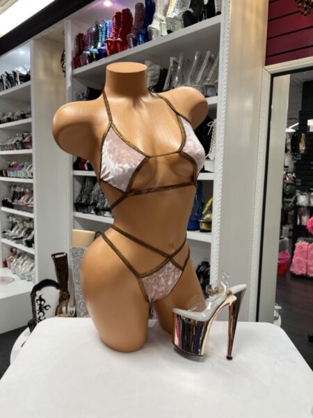 Velvet Two Piece featuring blush pink crushed velvet, bronze trim, front cutout design, adjustable halter ties, and wraparound waist straps.
