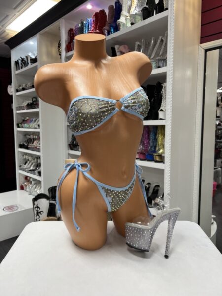 Blue floral rhinestone bikini featuring a bandeau top with a center ring detail and matching tie-side bottoms with baby blue trim.