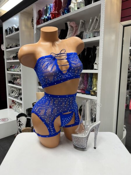 Blue rhinestone garter set with a lace-up crop top, sheer geometric mesh, and matching high-waisted garter bottoms.