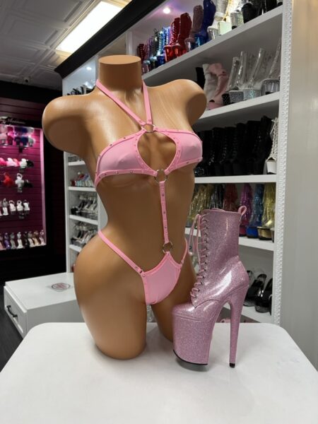 Pink Ring Harness Monokini with rhinestone trim, decorative metal rings, adjustable straps, and high-cut one-piece design.