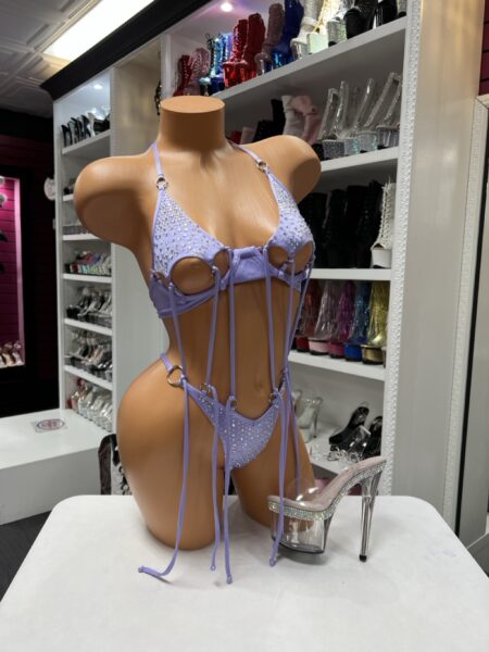 Lavender Rhinestone Fringe Set featuring a rhinestone embellished bralette, matching thong, decorative hanging fringe straps, and silver-tone ring accents.