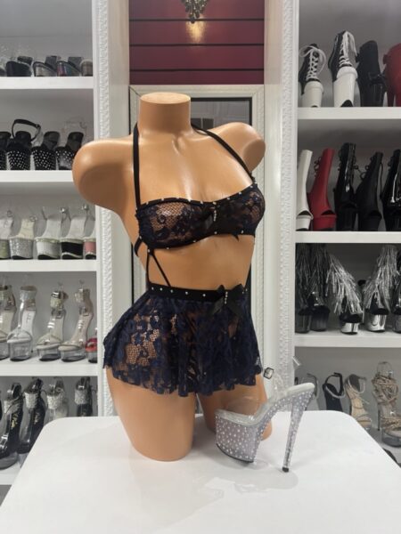 Navy Lace Skirt Set featuring a floral lace underwire bra, matching lace mini skirt with an attached thong, rhinestone accents, satin bows, and adjustable shoulder straps.