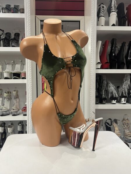 Sage Velvet Romper featuring soft stretch velvet, sparkling rhinestones, adjustable shoulder straps, a lace-up front, dramatic front and side cutouts, and a flattering one-piece design.