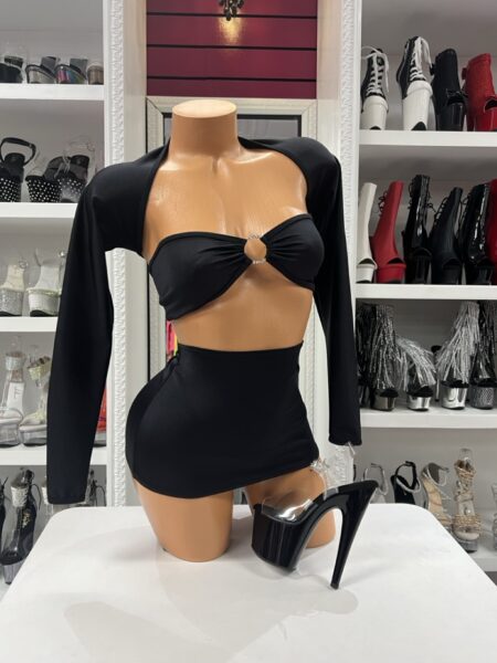 Black Ring Skirt Set featuring a bandeau ring crop top, matching thong, mini skirt, and separate long sleeve shrug.