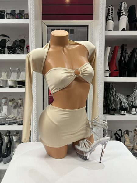 Cream Ring Skirt Set featuring a bandeau ring crop top, matching thong, fitted mini skirt, and separate long sleeve shrug.