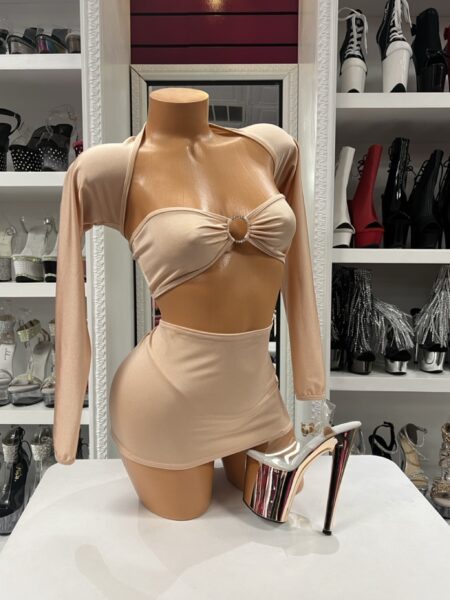 Nude Ring Skirt Set featuring a bandeau ring crop top, matching thong, fitted mini skirt, and separate long sleeve shrug.