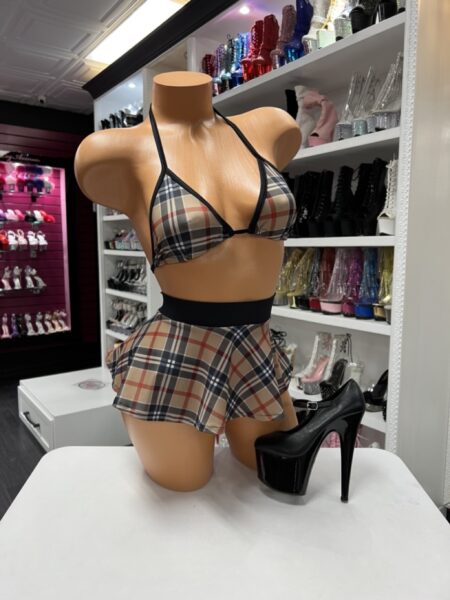 Brown Plaid Skirt Set featuring an adjustable triangle top, matching flared mini skirt with a black waistband, and a brown, black, tan, and red plaid print.