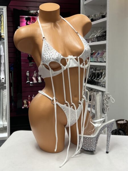 White O Ring String Bikini featuring rhinestone embellished cups, matching thong, polished O-ring hardware, adjustable halter straps, and dramatic hanging strap details.