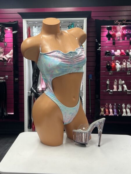 Pastel Cutout Bodysuit featuring iridescent pastel fabric, sweetheart neckline, adjustable clear straps, dramatic side cutout, high-cut leg, and cheeky back.